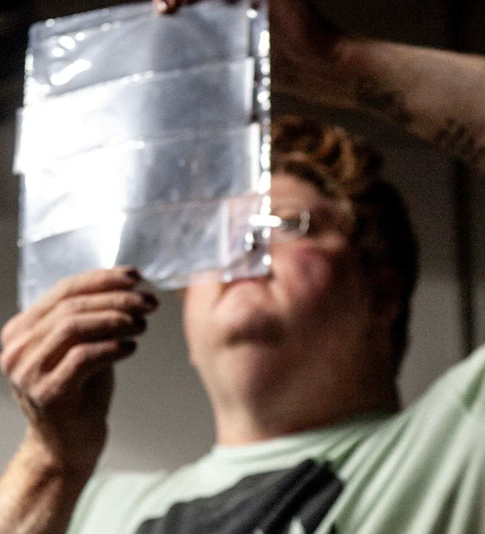 person looking at film